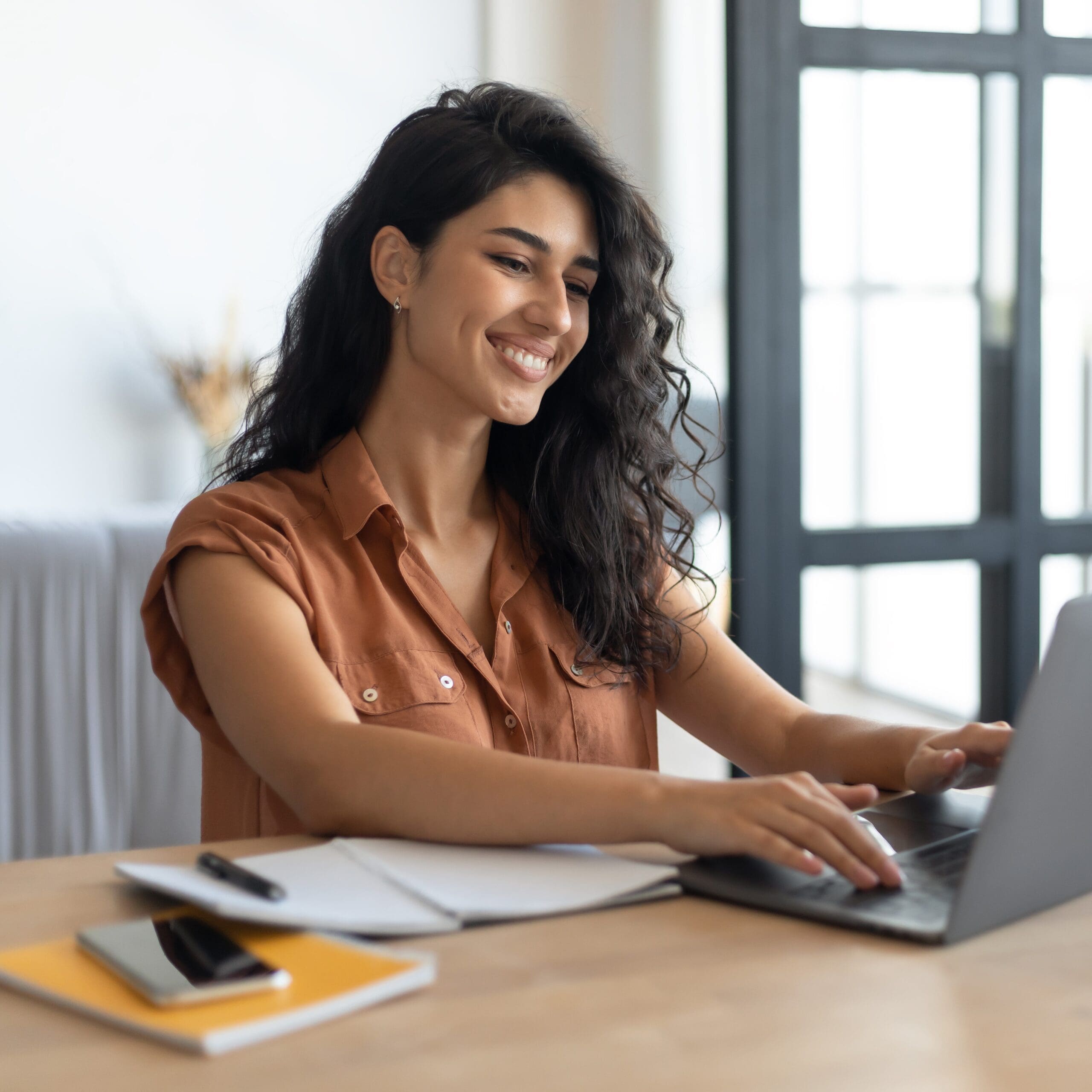 A woman smiling because she knows Pregnancy Care Center offers Free Ultrasounds in Fresno, California