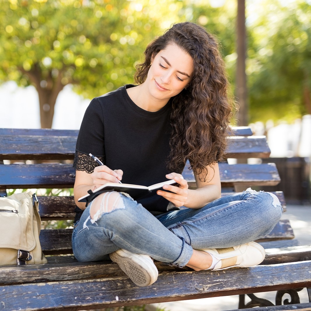 Woman researching, "Your Pregnancy Options: A Guide to Making Informed Decisions"