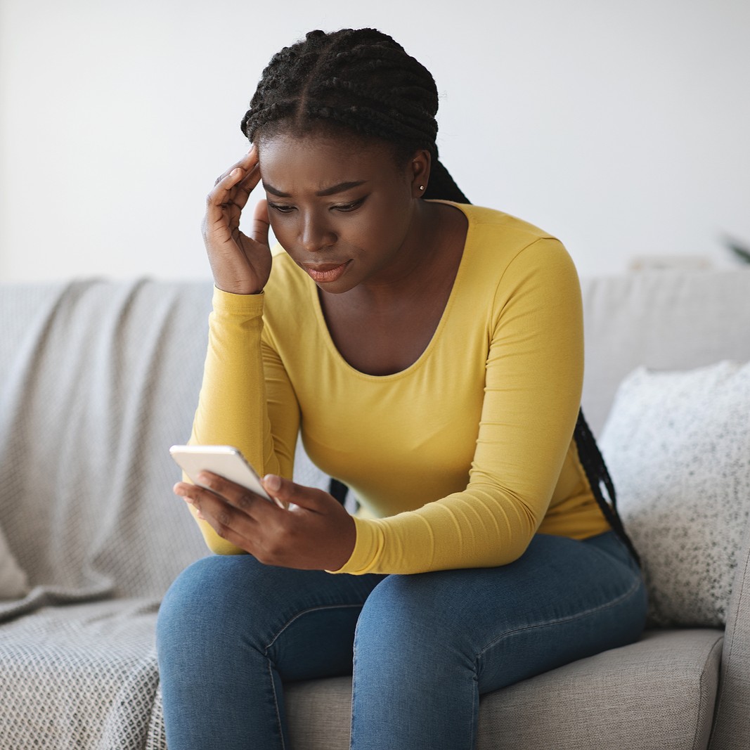 Woman searching on her phone, "How Does the Abortion Pill Work?"